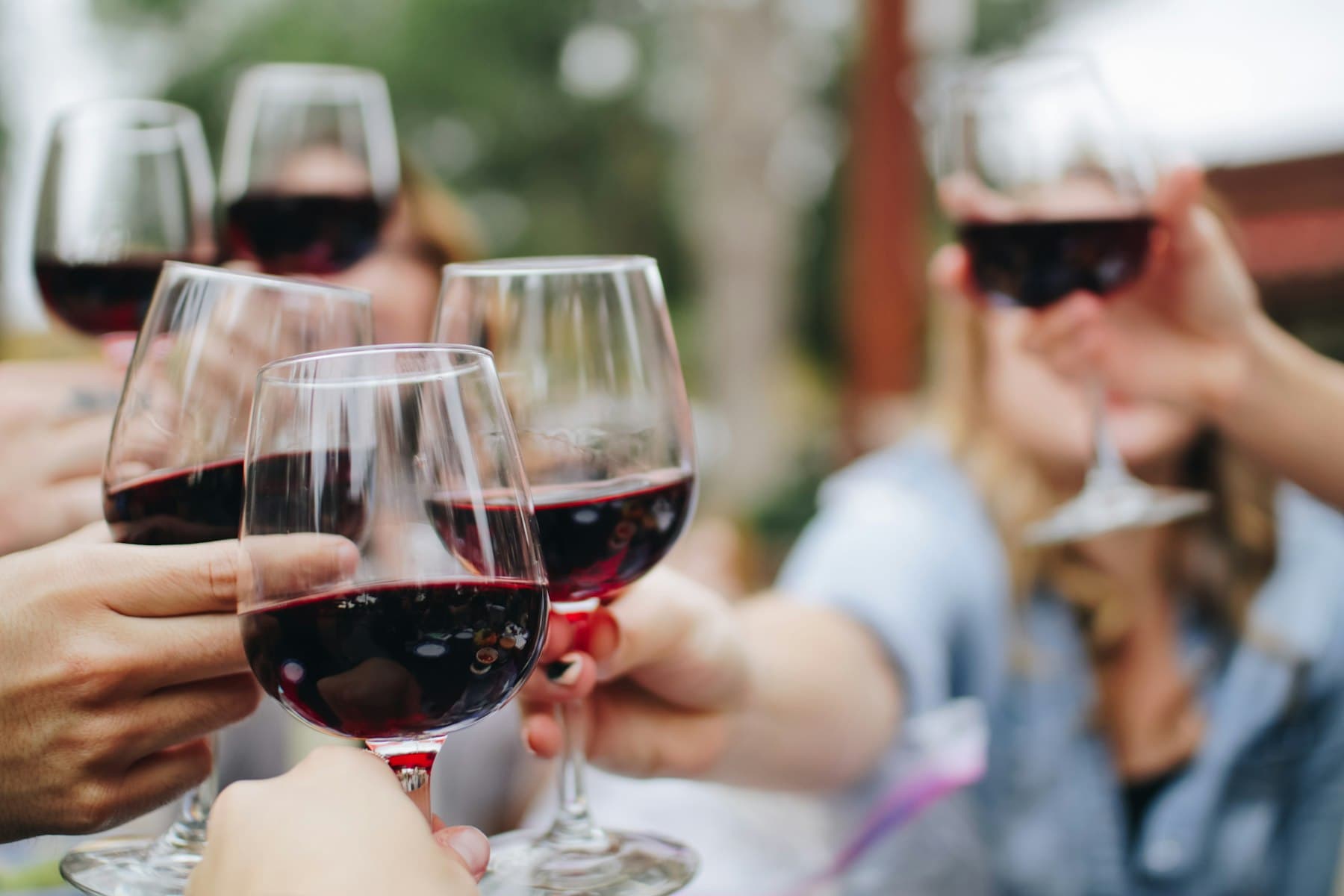A wine-country table — glasses and a produce plate