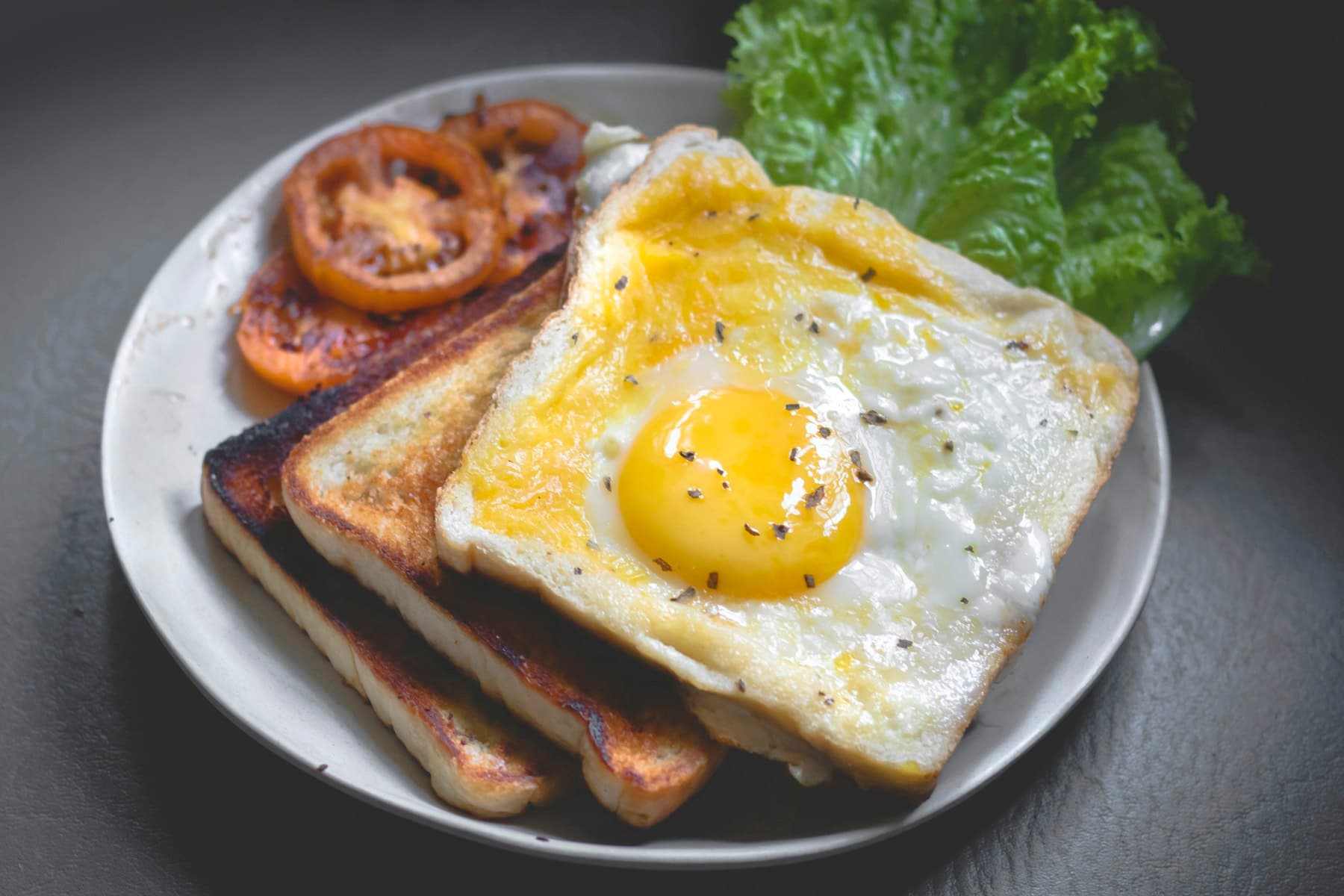A weekend brunch table — eggs, bread, and coffee