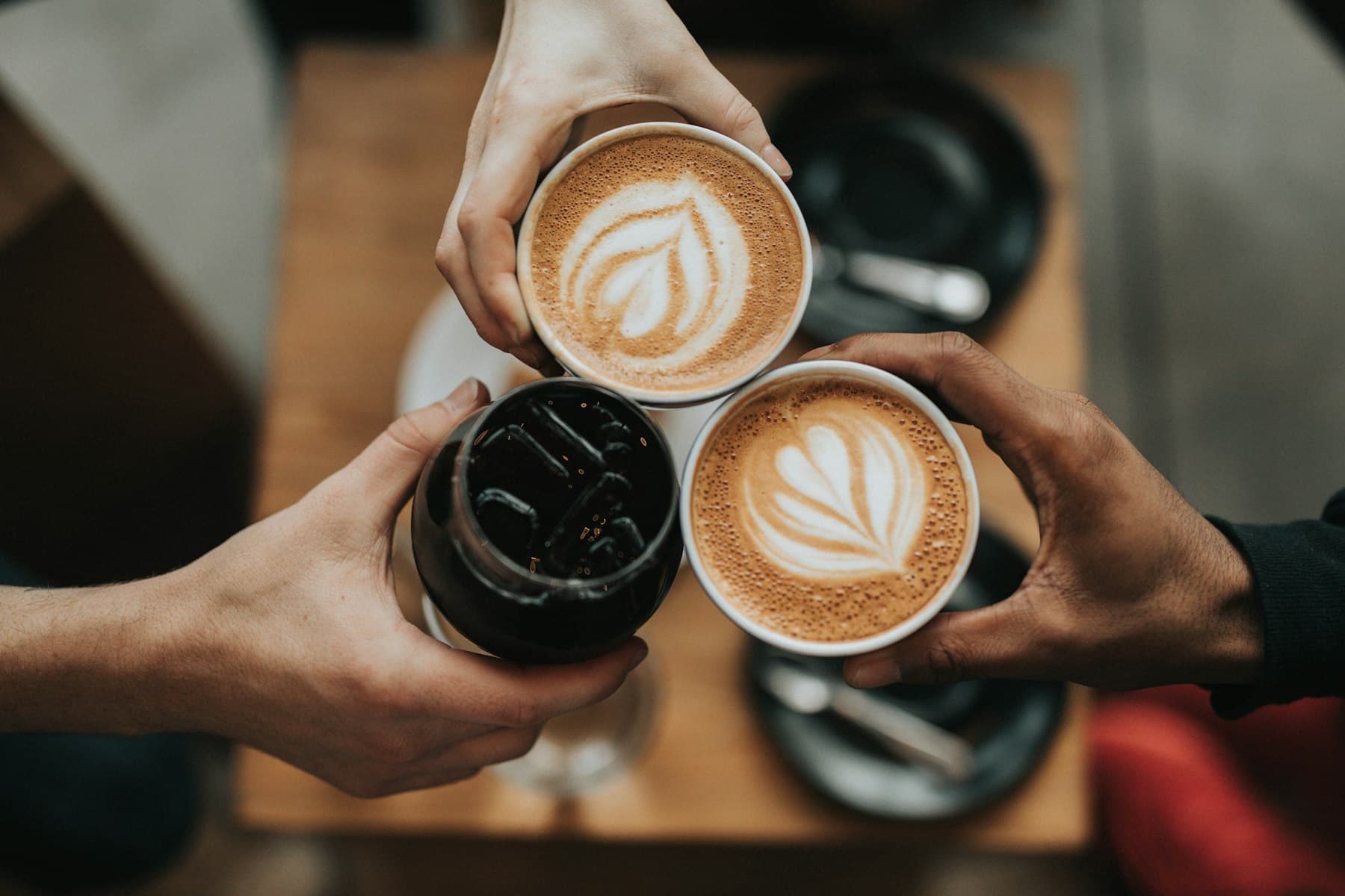 A café flat white on a wooden table — Australian coffee culture