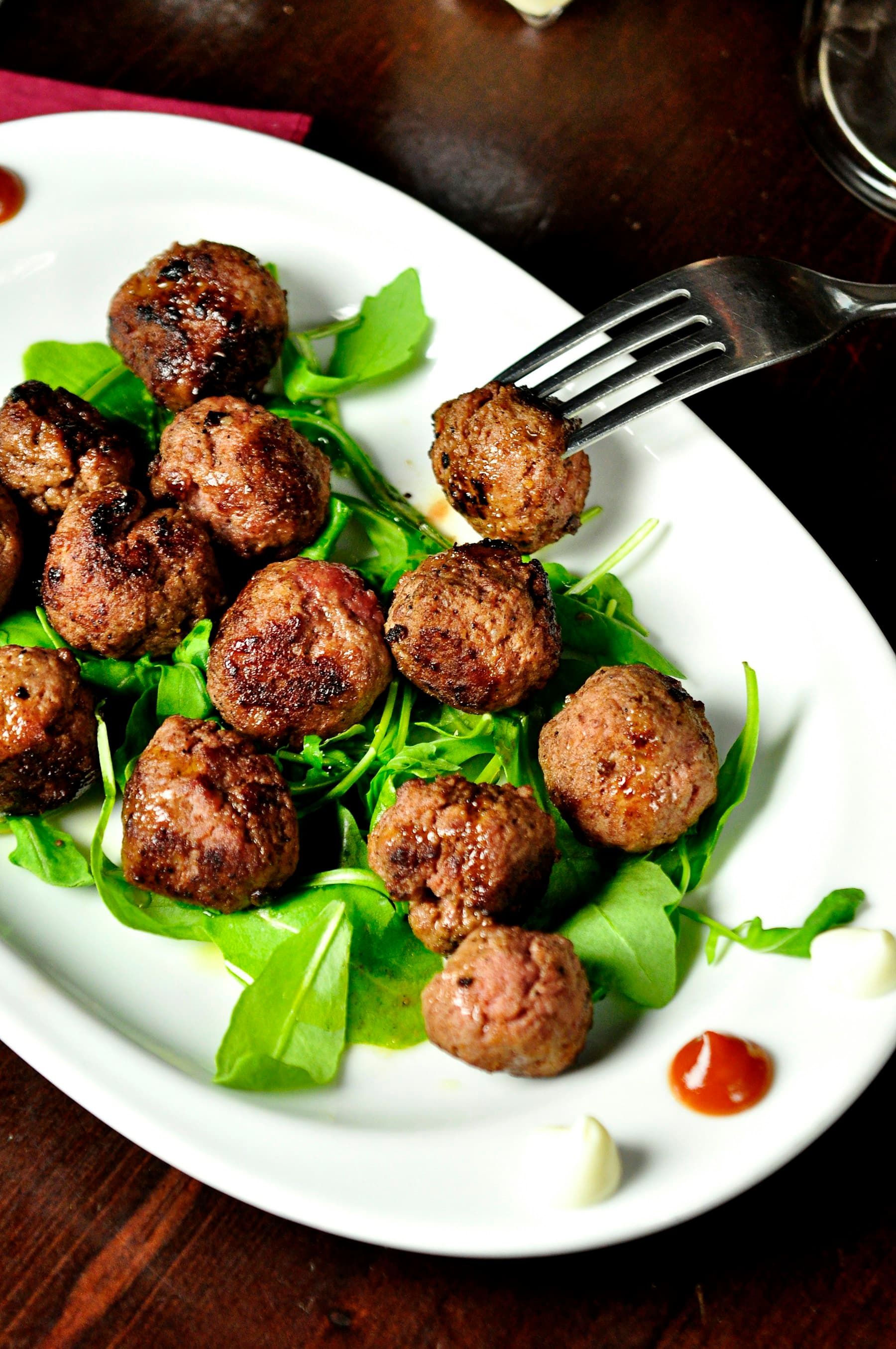 Shared Middle Eastern dishes — grilled meats, herbs, and flatbread