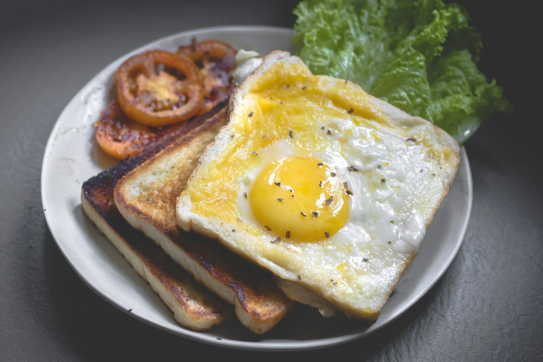 A weekend brunch table — eggs, bread, and coffee